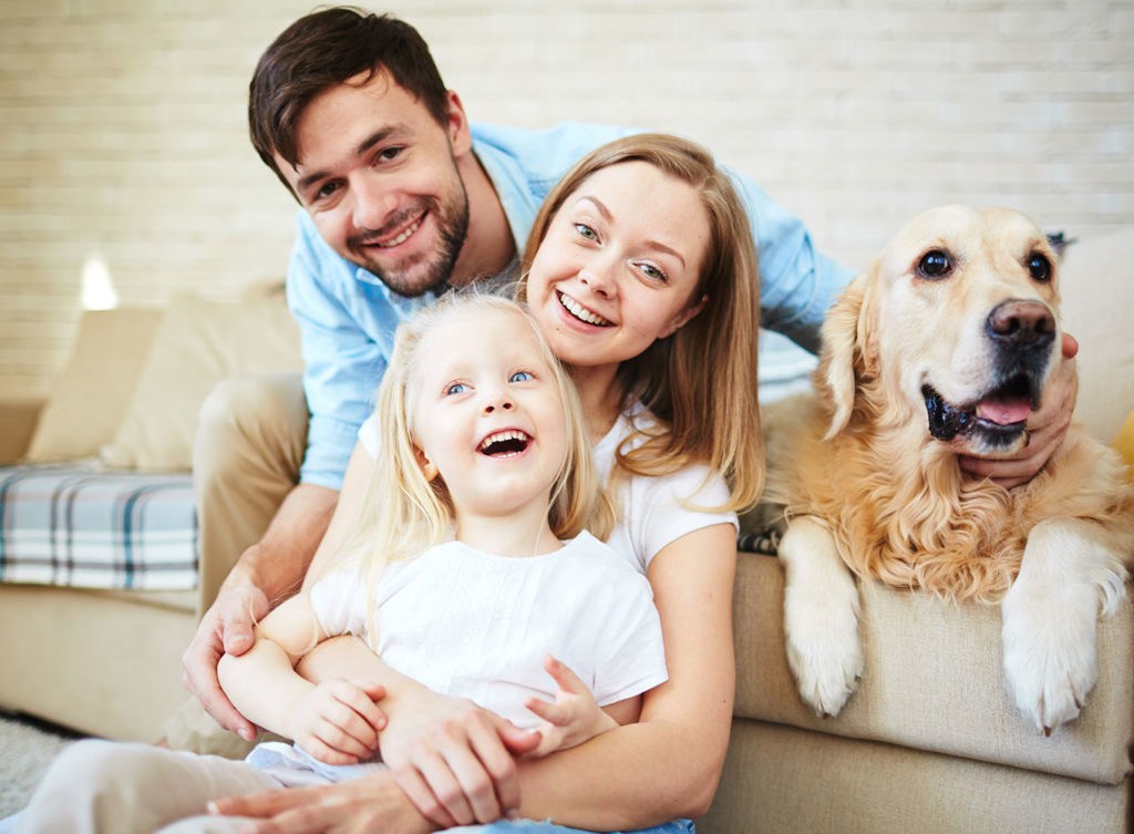 young family in dog living comfortable in home